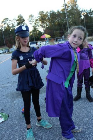 This police officer decided to handle matters quietly on the other side of the parking lot, as she arrested the Joker.