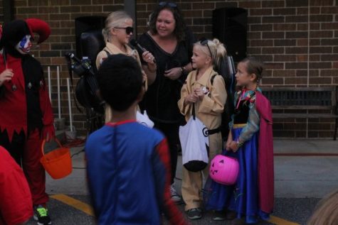 Since the children were busy collecting all the candy they could, not many people entered in the costume contest. Amongst those who entered, the siblings dressed up as ghost buster characters came in first place. In second place was Anna from Frozen and in third place was a clown.