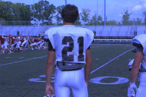 Tyler standing on the sidelines, waiting to be called onto the field.
