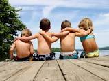 Friends sitting on a dock.