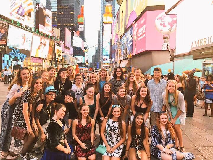 In the midst of the chaos, the students gathered to capture the moment in Times Square.