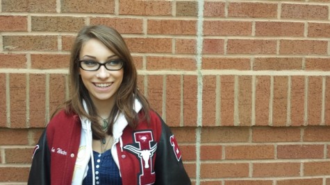 Student, Sam Waters, stands in the halls of Lambert with confidence in her talking points.