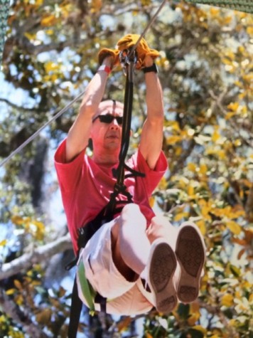 An old picture of Mr. Sims as he enjoys outdoor activities in the nature