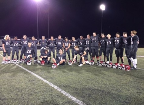 The 2015 varsity football team posed together after their final game, before saying fairwell to the friends they had grown so close to on the team.