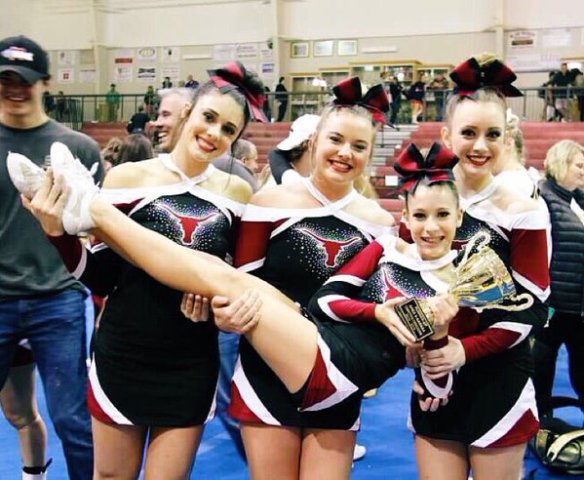 Some of the varsity competition cheerleaders celebrating their success at the regional competition. 