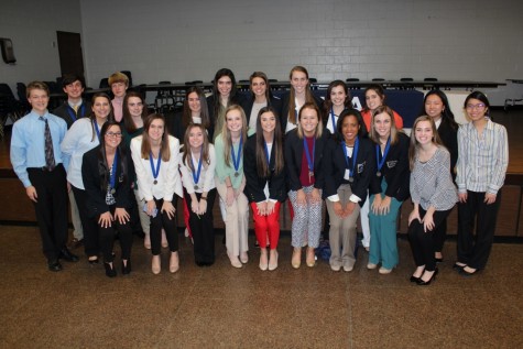 DECA team smiles proudly after serving up a huge dose of Lambert pride at the DECA region competition.