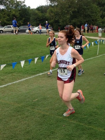 Me running as a senior... Still suffering but this time with a carefully cultured smirk for the camera. 