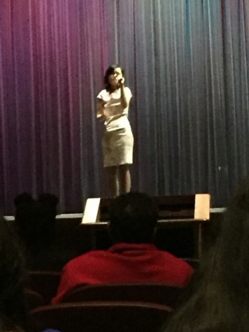 Celia Lee sings, encouraged by cheers of the audience. 