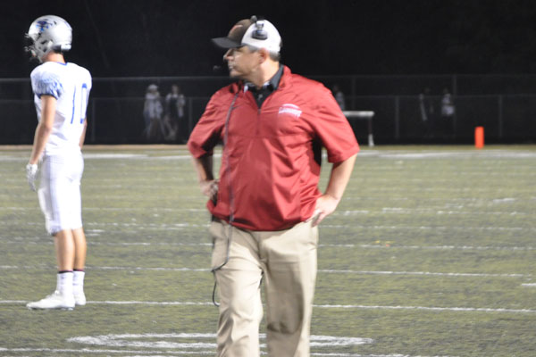 Lambert Head coach Louis Daniel look on as his Longhorns take the field