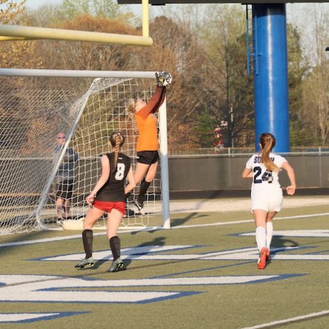 Jordyn blocking a goal during a game.