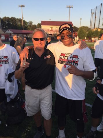 Jaryd and his coach after winning the state championship.