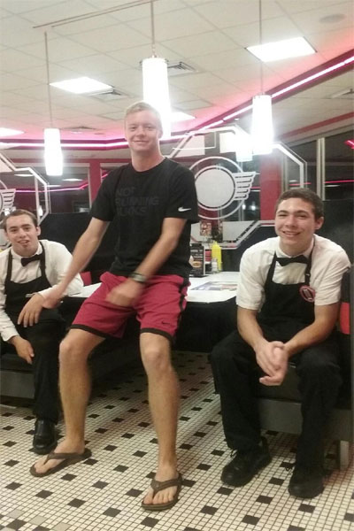 (From left to right)
Collin Burt (senior) and Max Kimble (junior) , both full time students at Lambert, smile at the camera during their short break off at Steak 'n Shake. 