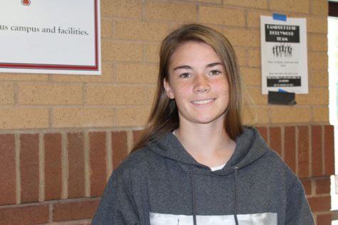 Lambert senior Ashley Tigue, is the daughter of James and Brittany Tigue, both who teach at Lambert. She smiles for the camera after her interview.