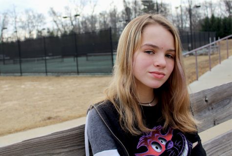 Sitting outside by the tennis courts, freshmen Hanna Wood explains what it's like to have ADHD and how it affects her life.