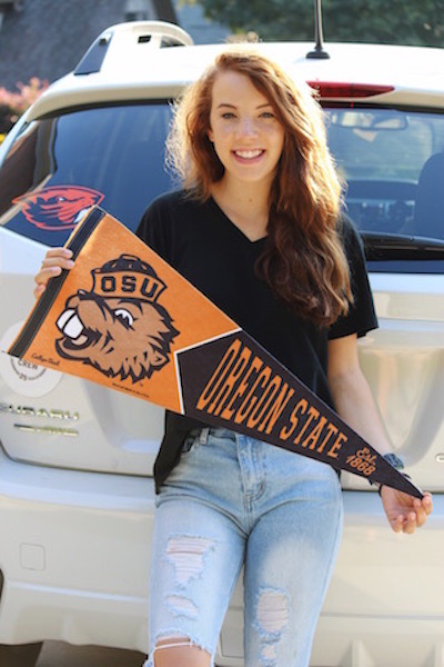 Victoria Shelton proudly holds her Oregon State flag.