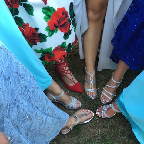 Prom shoes are seen for thirty seconds for a quick picture then hidden under the dresses again.