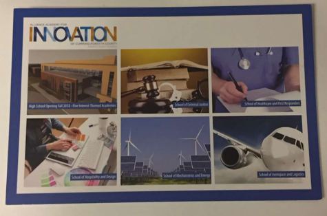 Assistant Principal Cannizzaro offers papers with details about the upcoming Alliance Academy for Innovation. She has been involved in the planning and developing of the new school of which she will become Principal when it opens.