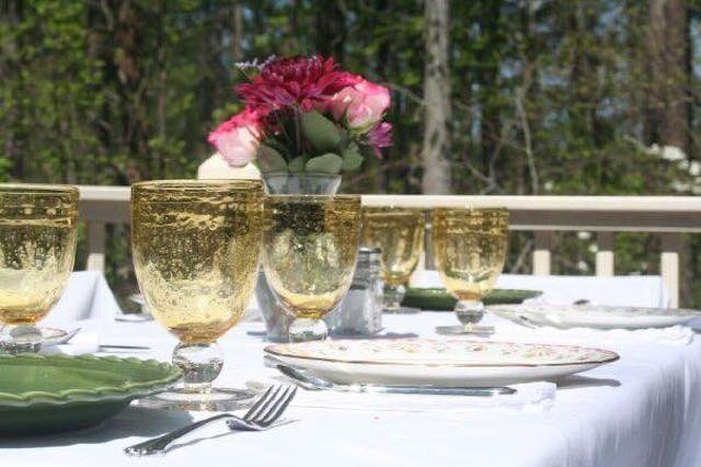 The table was beautifully set  with decorative glasses and bright flowers for a pre-prom dinner.