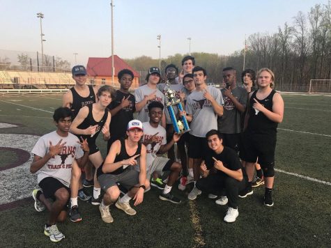 The boys side of Lambert High School's J.V team pose with their first place trophy at the junior varsity region championship.