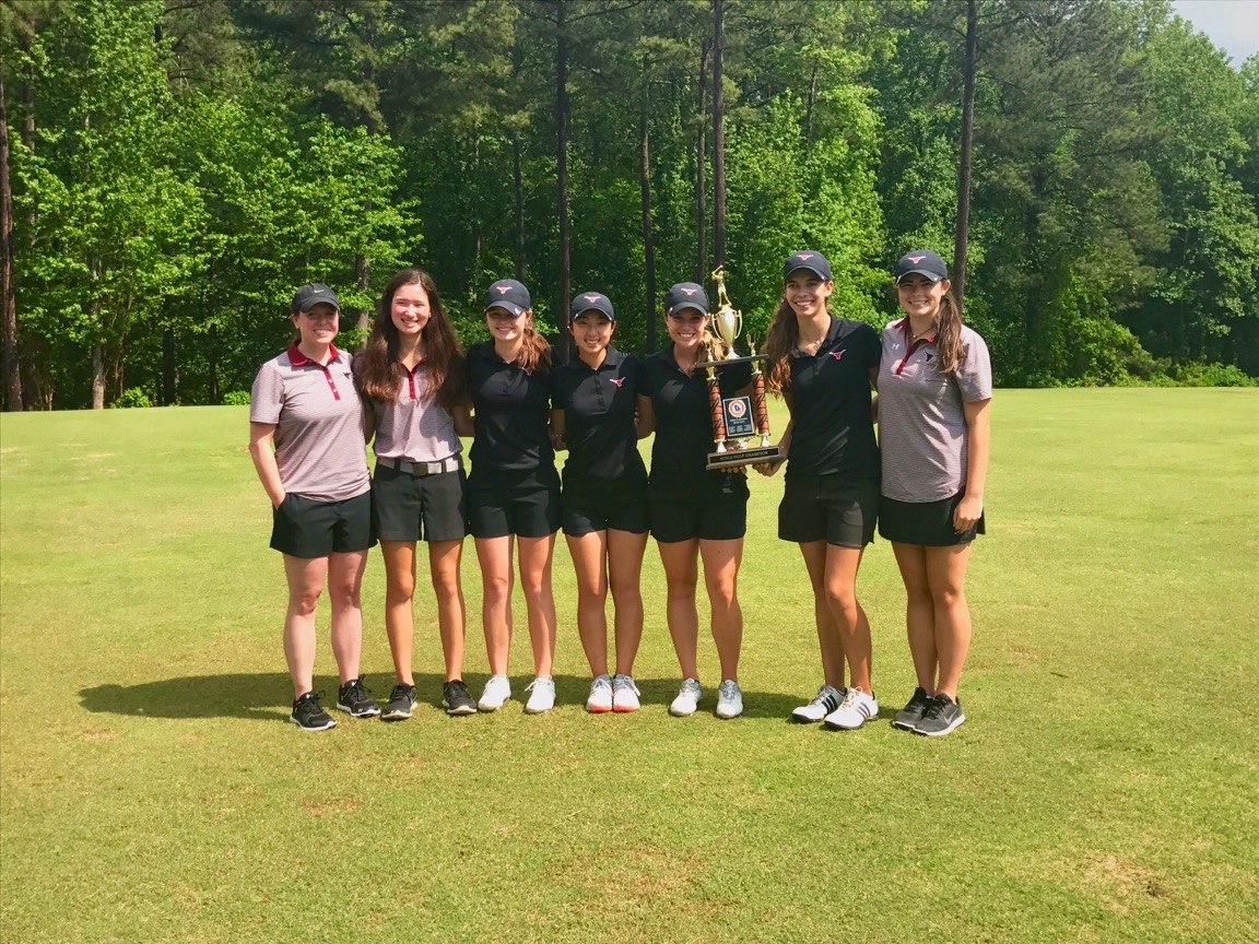 All smiles for the golf team with their eighth consecutive region championship. 