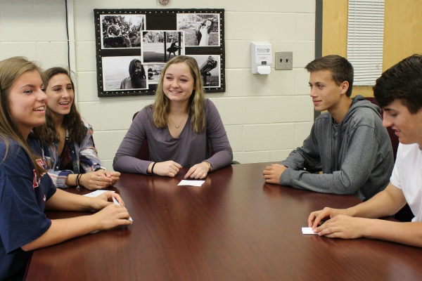 The sophomores behind dude. be nice week discuss the visible effects of dude. be nice week. The five have worked hard to plan and promote the week.