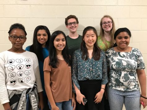 The A Cappella club takes a break from harmonizing in their afternoon practice to take part in a group photo.