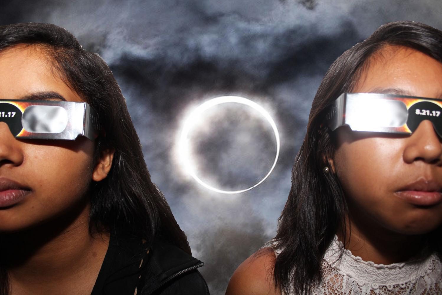 Lambert students, Allie Tatoy and Nethra Pillai, show off their school-issued eclipse glasses.
