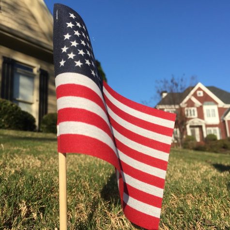 The red on the United States of America's flag represents valor, the blue symbolizes justice, and the white stands for purity. There is one red or white stripe for each of the original 13 colonies, and there are 50 stars in the blue corner for each state in America.