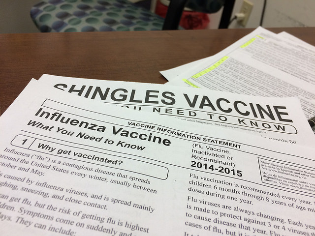 Photo by Bill Smith, published November 7, 2014,  Some rights reserved, License link: http://bit.ly/1mhaR6e, original link to work:  http://bit.ly/2n5HyYp, Papers are seen with information regarding influenza.