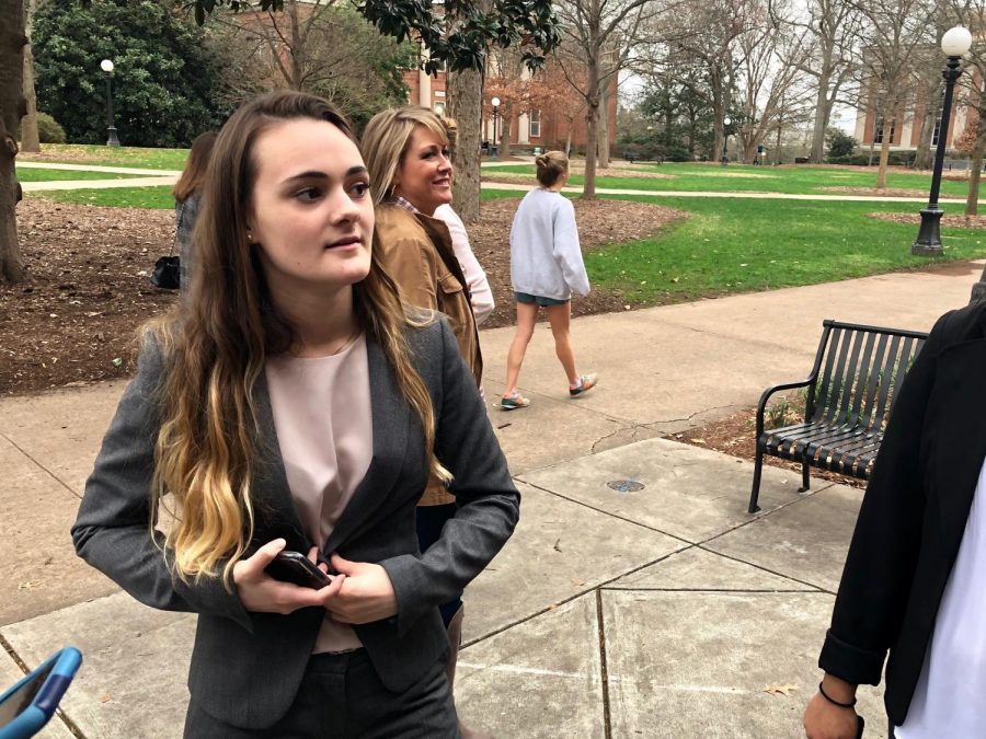 Senior, Diellza Koraqi, talks with her team mates outside the UGA law library after competing in the 2018 district mock trial competition.