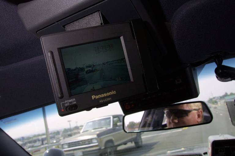 Outside Pierce County, public security departments have long been using dashboard cameras. Pasco police Officer Brad Gregory is cruising with a new video camera down Court Street to film the traffic in 2001. FILE HERALD FILE PHOTO EVAN PARKER, 2001.
