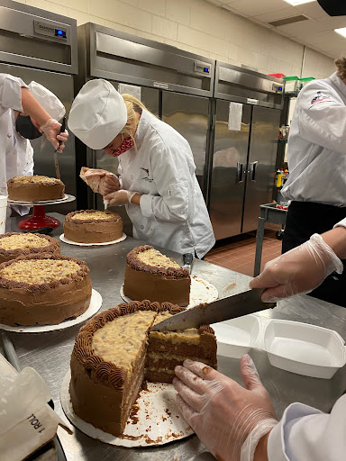 Students cutting cakes in the Culinary pathway. Photo taken by Grace Palmer on September 15th 2020 at 11:13 AM. All rights reserved.
