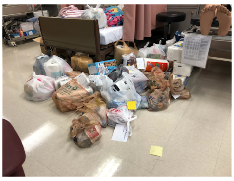 The photo here shows a portion of goods that the students of Lambert High have donated. The items here consist of things ranging from blankets, toiletries, and canned foods. (Lambert Post/Ashley Choi)
