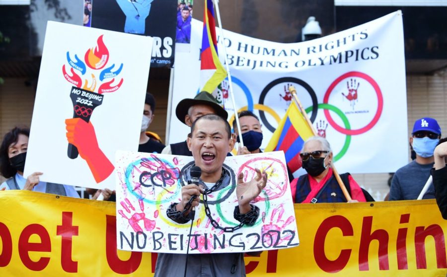 Chinese protestors to stop the 2022 Winter Olympics in Beijing, China. December 6, 2021. The U.S. has announced they will not be sending official delegation to Beijing for the Olympics. (Frederic J. Brown/@americanpost) 

