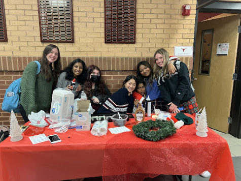 Photo of Nora Zhao (center) and Riya Jegajeevan (second on the right), with their friends who helped with the Puppuccino Stand. December 6th, 2021. This was the first day of the stand and the start of a great journey to spread mental health awareness. (Samantha Nyazema)
