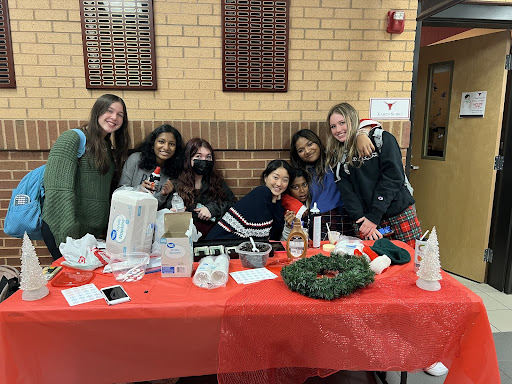 Photo of Nora Zhao (center) and Riya Jegajeevan (second on the right), with their friends who helped with the Puppuccino Stand. December 6th, 2021. This was the first day of the stand and the start of a great journey to spread mental health awareness. (Samantha Nyazema)
