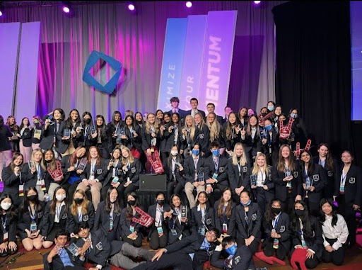Here is the Lambert DECA club posing for the camera during their convention after the awards ceremony. The students can be seen in business attire to set up a professional environemnt. (Lambert DECA)
