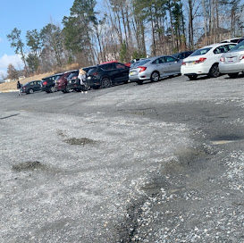 Photo of Lambert High School parking lot. February 24th, 2022. This photo shows the unsafe conditions of the gravel lot. (Chaney Duskin)
