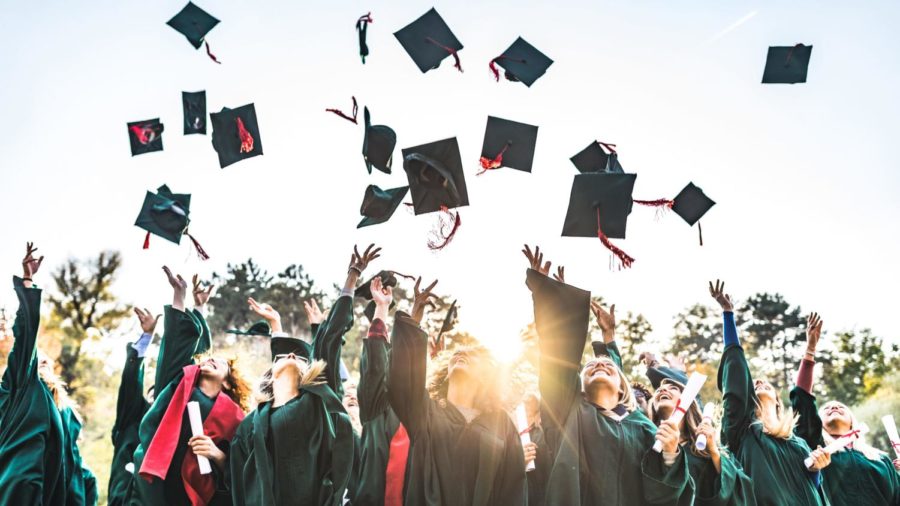 Group of students graduating from high school throwing their caps in the air. May 20, 2019. As exciting as graduation may seem, a students first has to take into consideration everything that goes into finsining high school. (Skynesher/Getty Images)
