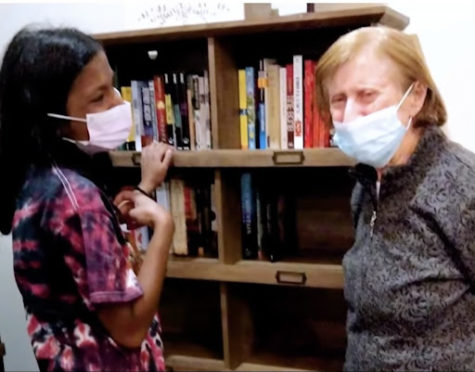 Here, Tara is at the library she built in her project with an early on-set dementia patient. April 2021. Working with others, they were able to garner enough books to set up a library for patients. (Tara Ravindranathan)