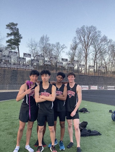 Four of Lambert’s Track and Field athletes pose for a photo. April 1, 2022. Jialong Cheng (second from the left) explained his experiences with track and field. (Lambert Track and Field)
