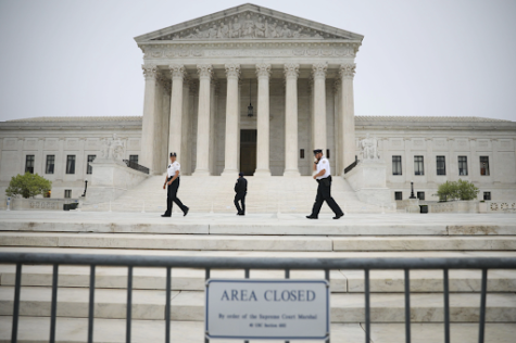 Guards take patrol around the supreme court after the leaking of the draft from these premises. Security has been tightened, as many protesters have surrounded the buildings in opposition to the draft decision. Photo taken by Tom Benner for The New York Times News Service on May 3, 2022. 