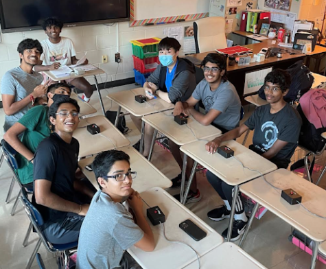 This is a picture of the junior varsity quiz bowl team practicing in a trivia round. Taken by Ms. Creuser on August 29, 2022.