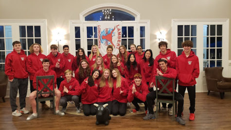 Lambert’s Swim and Dive team gather inside the Grand Cascades pool house. Photo courtesy of Coach Langley.
