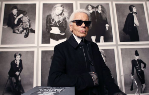 Karl Lagerfeld posing with some of his creative designs. The Met Gala for 2023 is set to pay homage to his work. Taken from Cardiff Student Media https://cardiffstudentmedia.co.uk/.