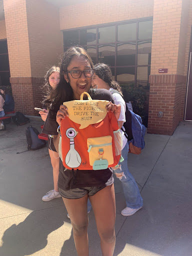 This is an image of Niyu holding her comical backpack. Niyu is currently a freshman at Lambert and a part of FBLA, FCCLA and Lambert Acting Troupe. Taken by Shriya Buche on September 13, 2022.