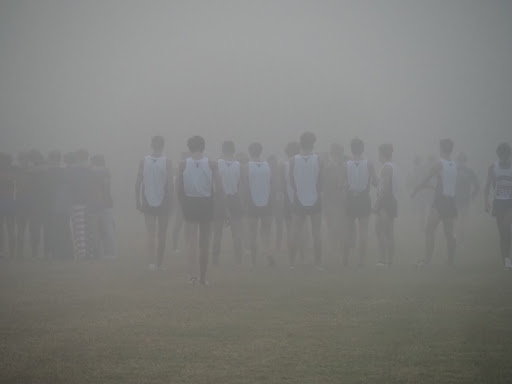 Lambert’s cross country team gathers around for a meet on October 15. They recently participated in the regional championship and will be competing in the GHSA State Championship. Courtesy of Jackson Hogsed.