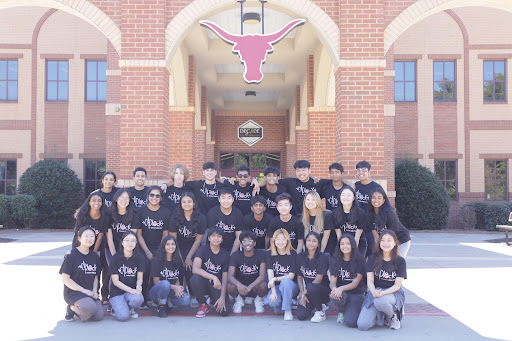 Lamber iGEM students posing in front of the school for their website, October 8, 2022