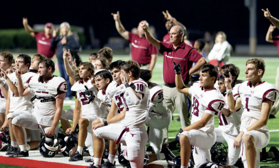 Lambert players and coaches celebrate a non-region win on Friday at Flowery Branch. Photo by Jay Rooney Photography.  