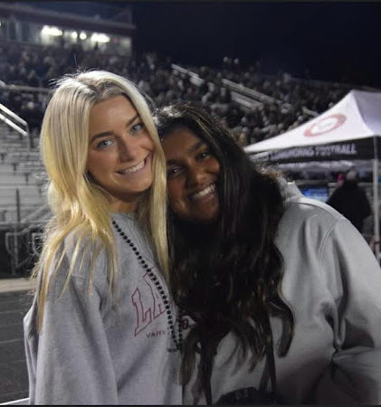 Diya Patel and Ella Majoli on the sideline during a home game against South Forsyth. Taken by Allison Mitchamore.